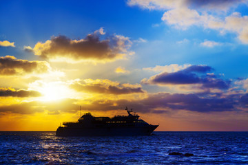 oceanic cruise ship at sunset