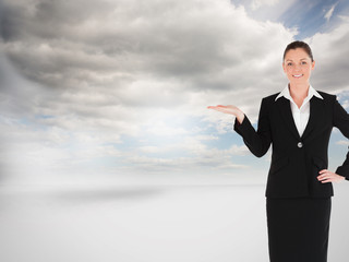 Composite image of charming woman in suit showing a copy space