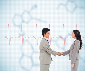 Composite image of side view of hand shaking trading partners