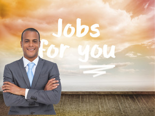 Composite image of charismatic young businessman with arms cross