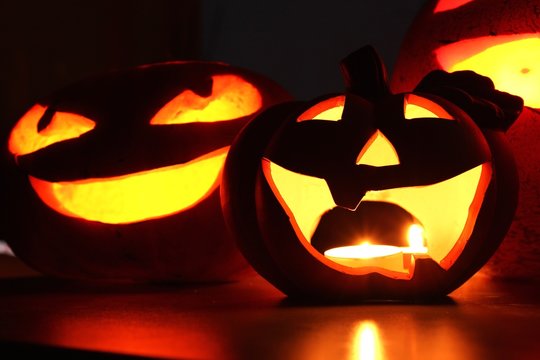 halloween pumpkin face and candles close-up