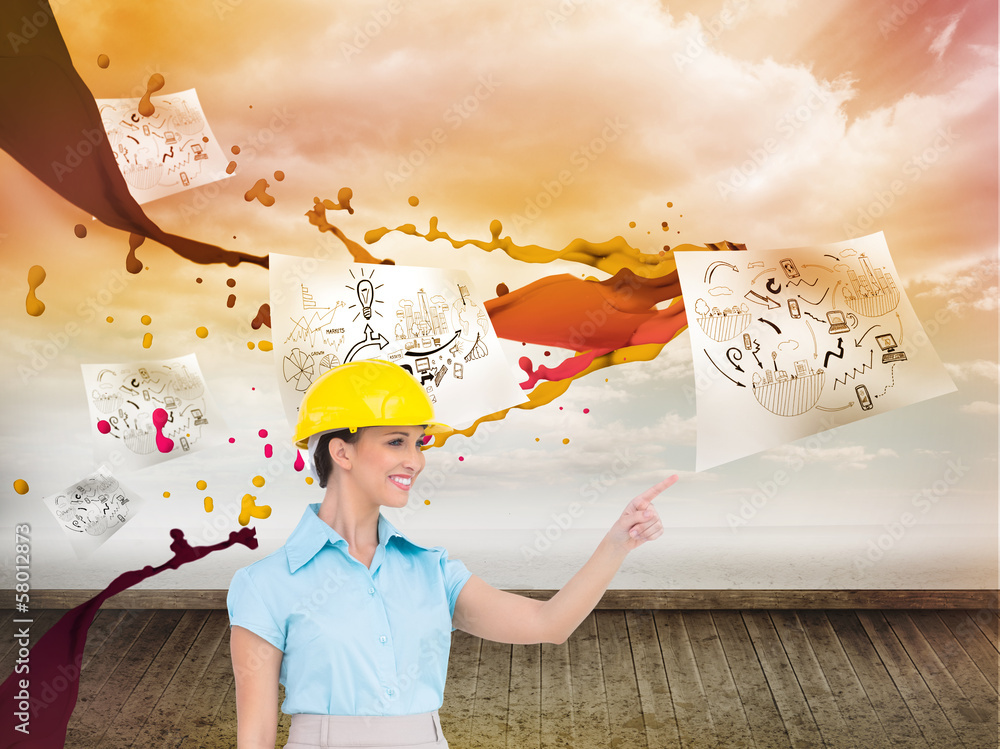 Poster Composite image of smiling attractive architect pointing