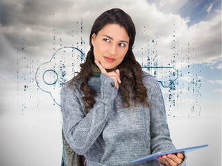Composite image of pensive model wearing winter clothes holding