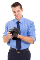 photographer checking photos on his camera