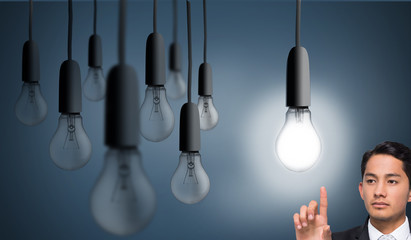 Composite image of unsmiling asian businessman pointing