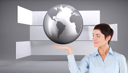 Composite image of businesswoman with an open hand to show a cop