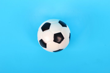 Fototapeta na wymiar Soccer ball blue background