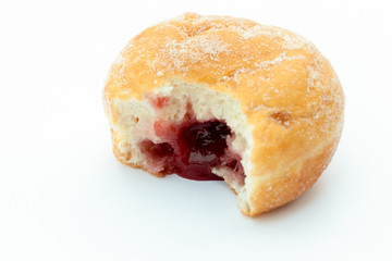 Jam donut with a mouthful taken out and jam showing