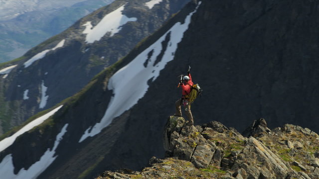 Aerial view of triumphant climber remote wilderness,  Alaska, USA