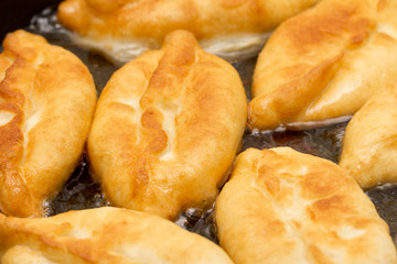 patties are fried in a pan