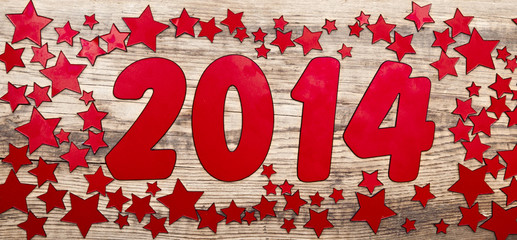 stars background and number 2014 on a old wooden background. Hap