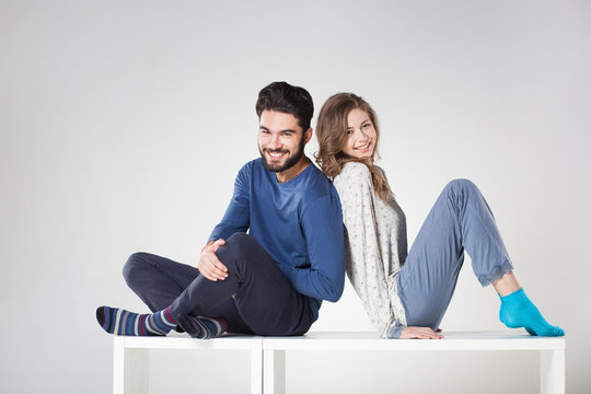 Happy Couple In Pyjama Posing In The Studio