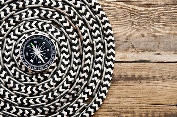 marine roll ropes and chain on wooden background