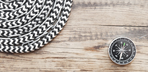 marine roll ropes and chain on wooden background