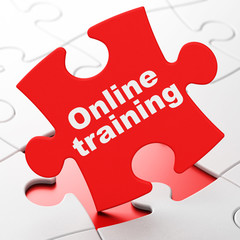 Education concept: Online Training on puzzle background