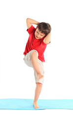 Children's yoga. The little boy does exercise.