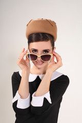 Beautiful woman brunette with sunglasses in retro style