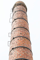 Old brownish orange brick smokestack or chimney