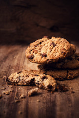 Chocolate chip cookies on wooden background. Stacked chocolate c