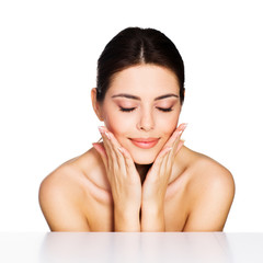 Beauty shot of a young model touching her face
