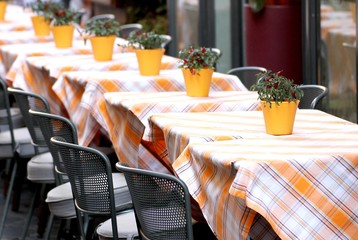 tables laid with checkered tablecloth for a stylish restaurant