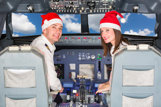 Pilots in the Cockpit with Santa Hat