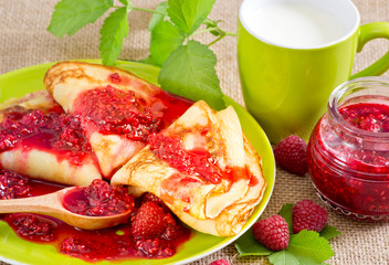 Pancakes with raspberry jam  and milk