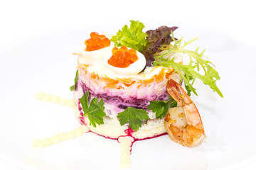 herring salad vegetables mayonnaise on a table in a restaurant