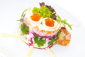 herring salad vegetables mayonnaise on a table in a restaurant