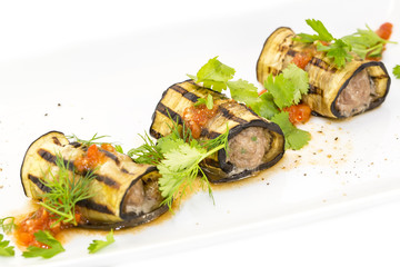 stuffed eggplant on a table in a restaurant