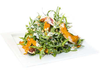 salad of arugula figs and cheese on white background