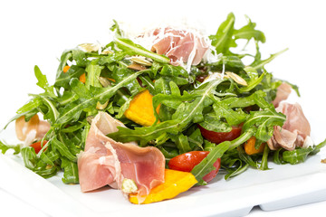 salad of arugula ham cheese on a white background