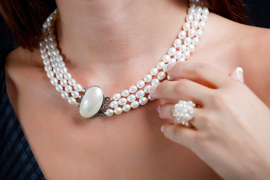 Woman with pearl necklace on her neck