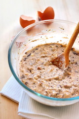 Mix of flour, eggs, bananas and chopped dark chocolate and walnu