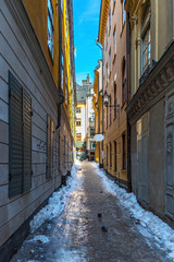 Obraz premium Picturesque narrow street in Old Town in Stockholm, Sweden.