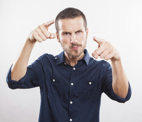 angry young man accusing you, pointing finger at you!