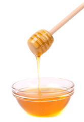 Bee honey with wooden dipper