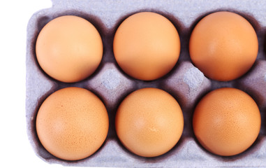 Brown eggs in egg box