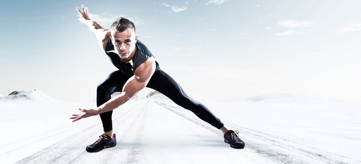 Triathlon runner man outdoor in winter snow landscape. Extreme f