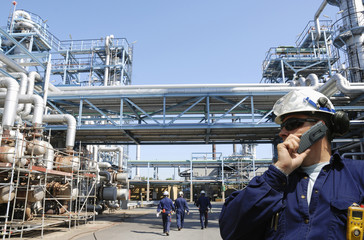 oil and gas workers inside large petrochemical industry