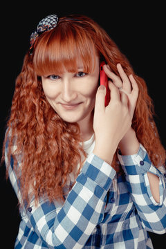 Red hair girl talking on the phone