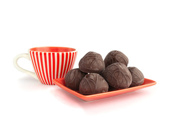 Сhocolate candies with cup of tea