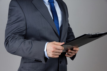 business man holding folder with documents