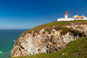 Fototapeta na wymiar Lighthouse on top of hill in Cabo da Roca.