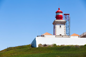 Fototapeta na wymiar Lighthouse on top of hill in Cabo da Roca, the most Western poin