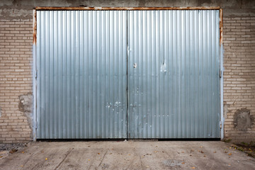 Fototapeta na wymiar Industrial building made of concrete with door