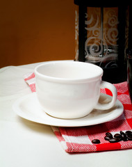 Cup of coffee with coffee beans on a beautiful background.