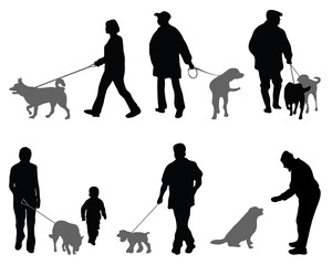 Silhouettes of people and dogs-vector