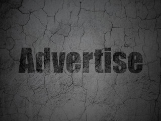 Advertising concept: Advertise on grunge wall background