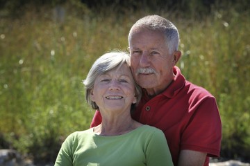 Happy old couple outside